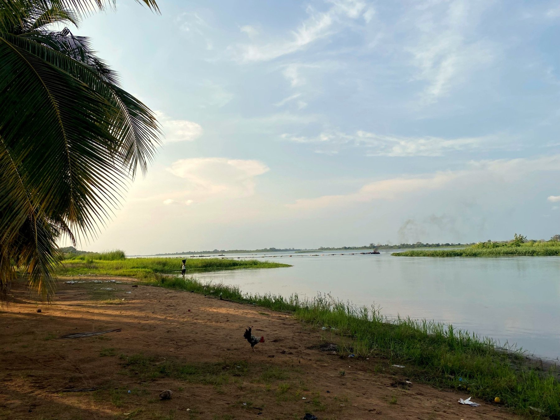Wide view of the Volta river from the sandy foreshore of Tefle Destination